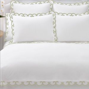 Aerin standard pillow sham with light green trim